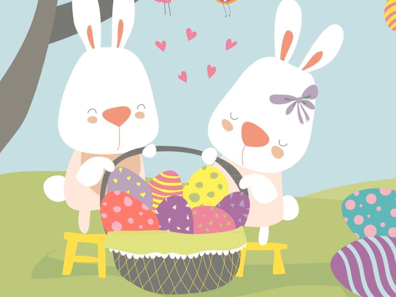 To søde påskeharer med en stor kurv fuld af påskeæg.